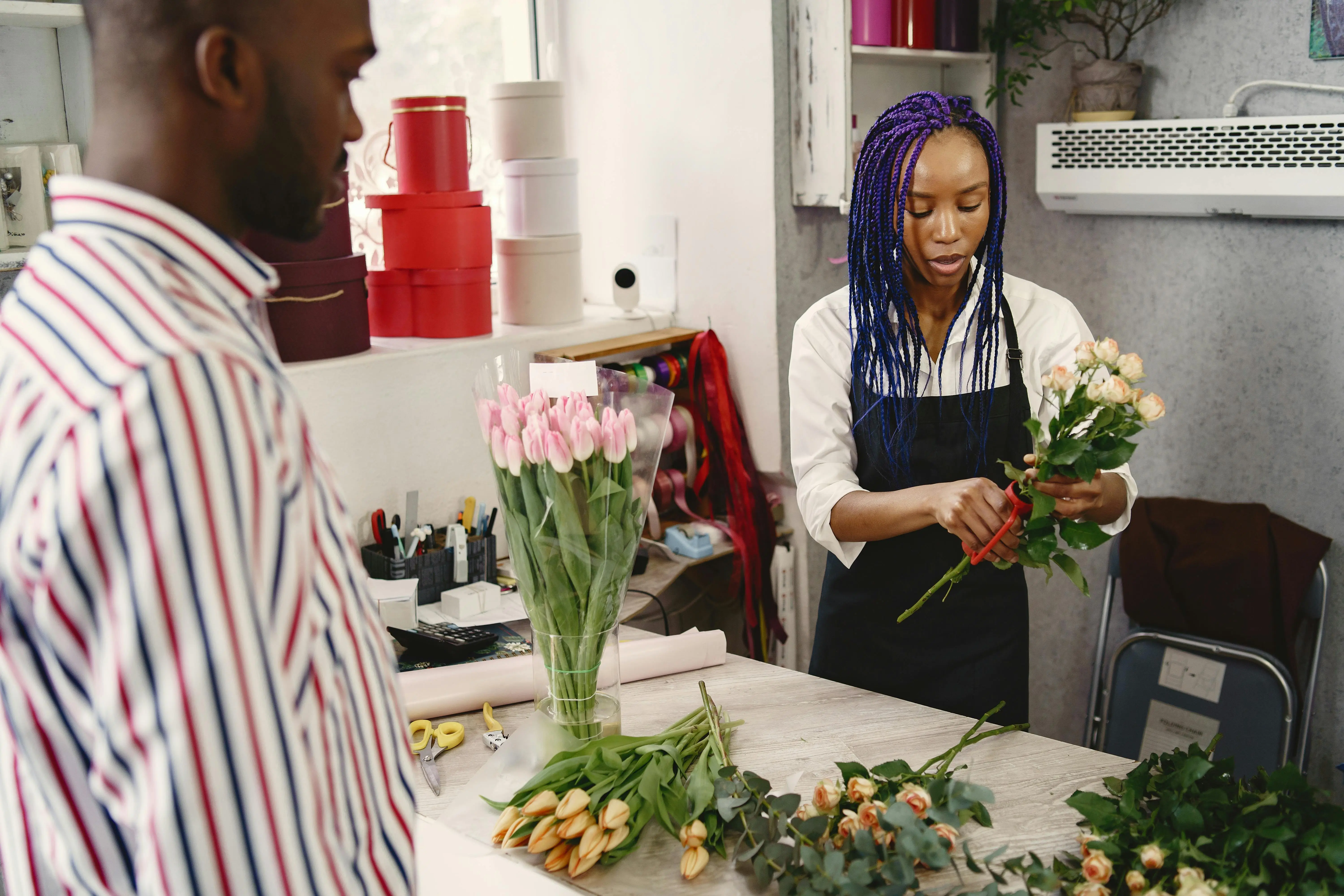 Nigerian business owner helping a client